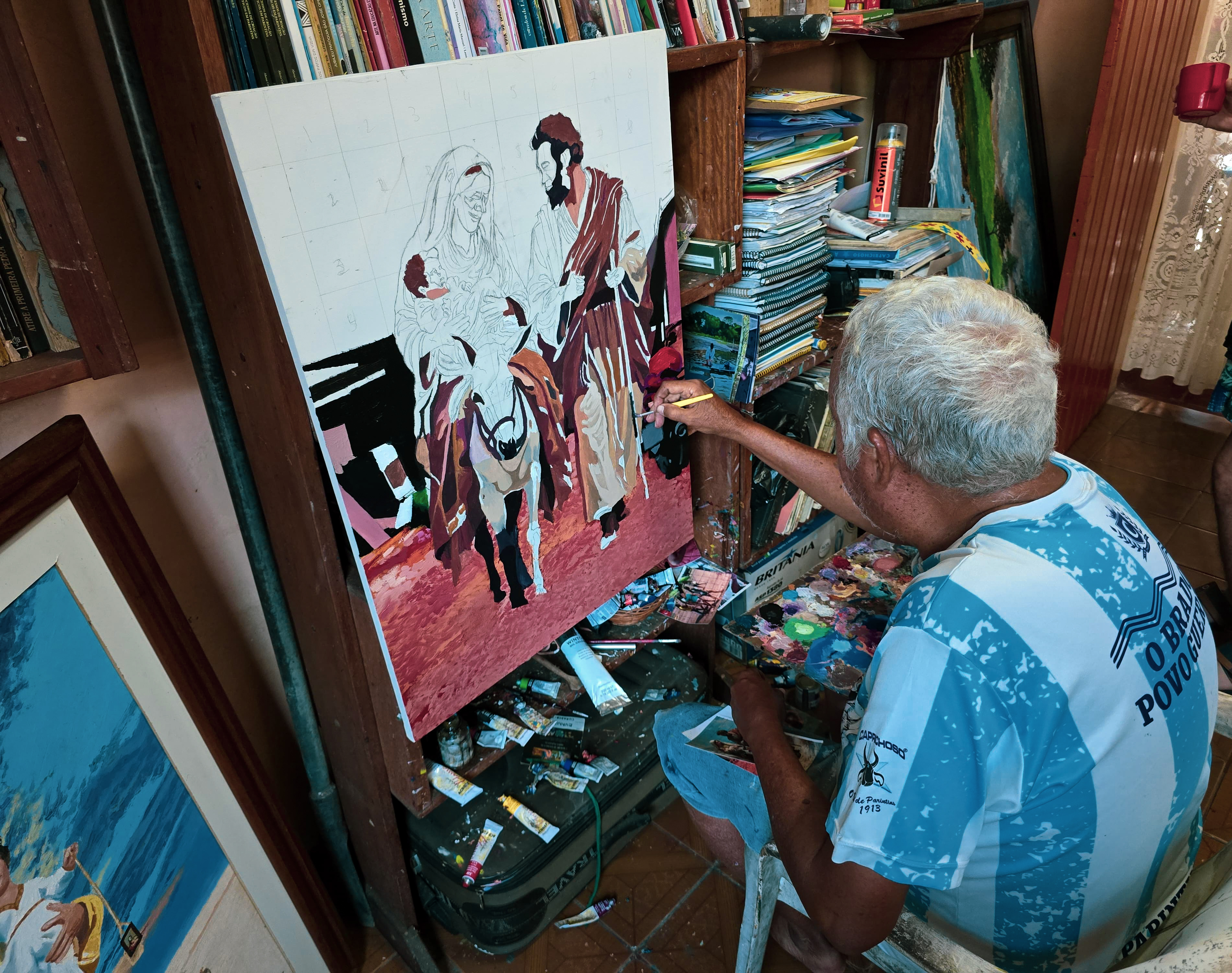 Evanil pintando uma de suas obras